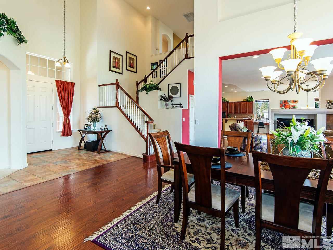 1635 Crater Court Reno, NV 89521 - Photo 3 of 25 a view of a dining room with furniture and a chandelier