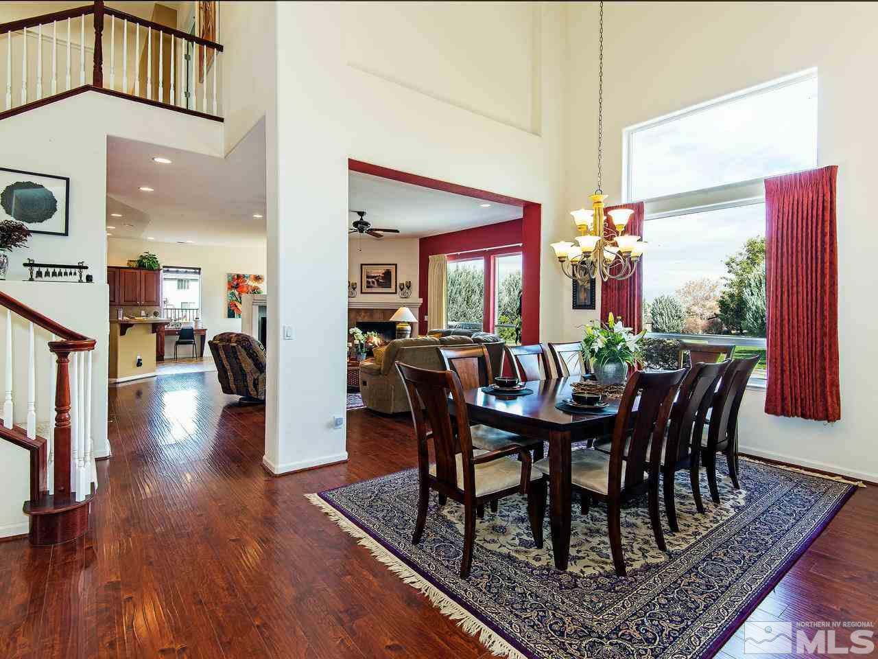 1635 Crater Court Reno, NV 89521 - Photo 4 of 25 a view of a dining room with furniture and wooden floor
