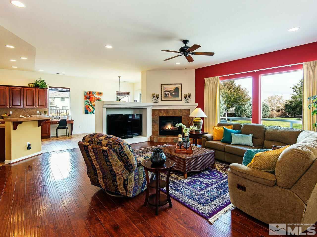 1635 Crater Court Reno, NV 89521 - Photo 6 of 25 a living room with furniture fireplace and a large window