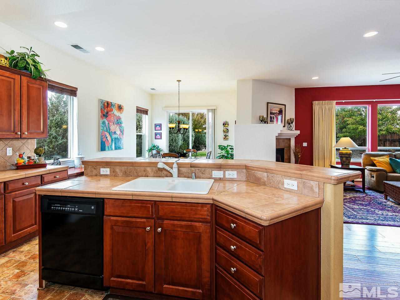1635 Crater Court Reno, NV 89521 - Photo 9 of 25 a kitchen with a sink and a large window