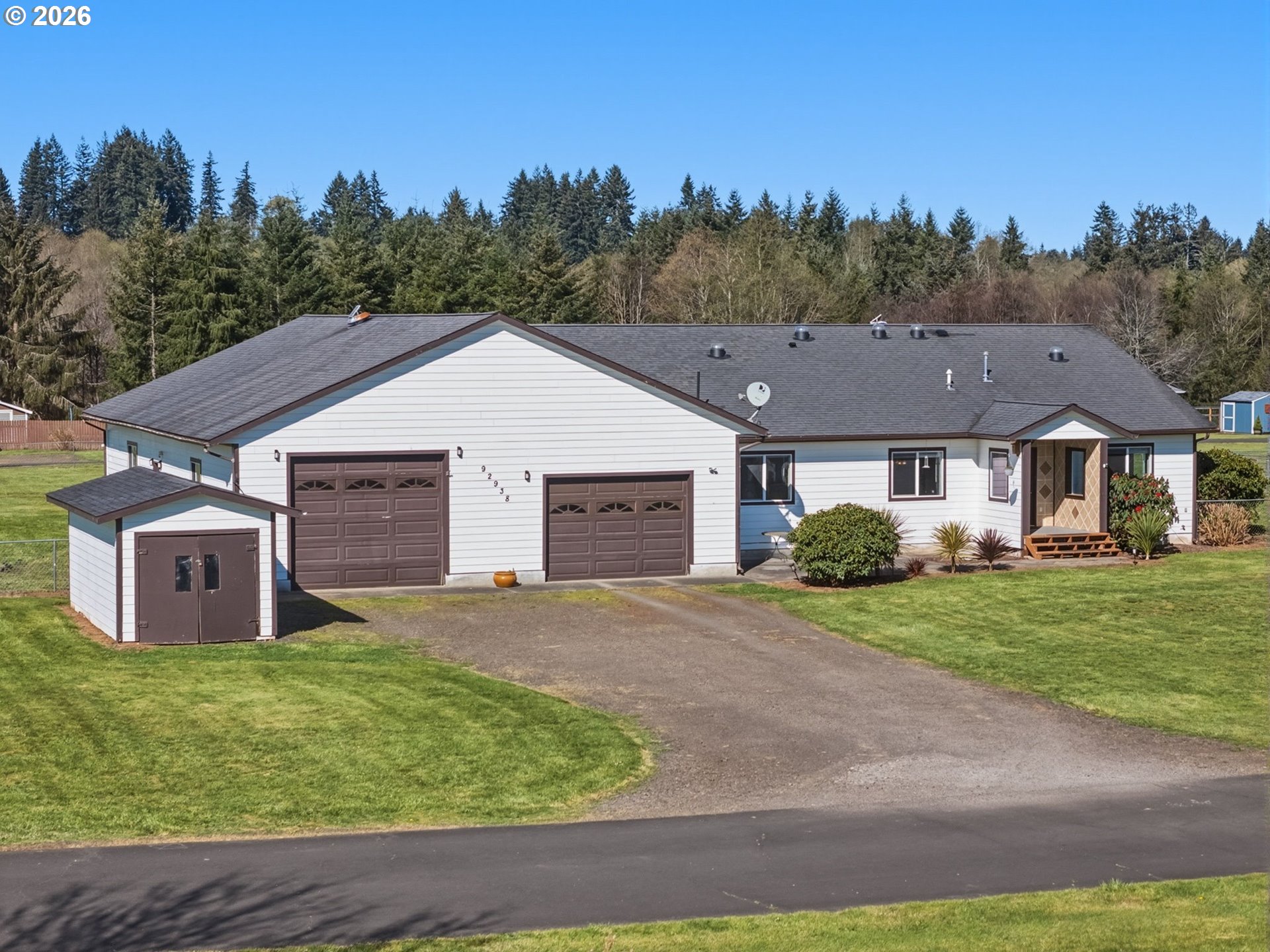92938 Amie Loop Astoria, OR 97103 - Photo 1 of 42 a aerial view of a house with a yard and large tree