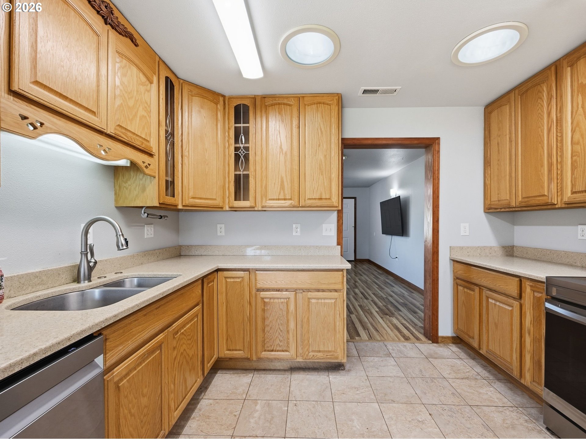 92938 Amie Loop Astoria, OR 97103 - Photo 11 of 42 a kitchen with stainless steel appliances granite countertop a sink and cabinets