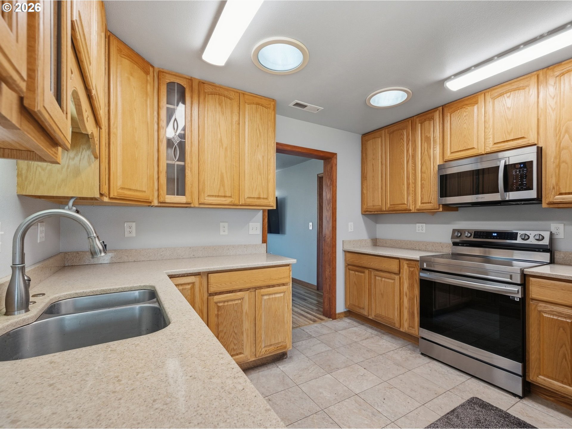 92938 Amie Loop Astoria, OR 97103 - Photo 12 of 42 a kitchen with stainless steel appliances granite countertop a sink and a stove