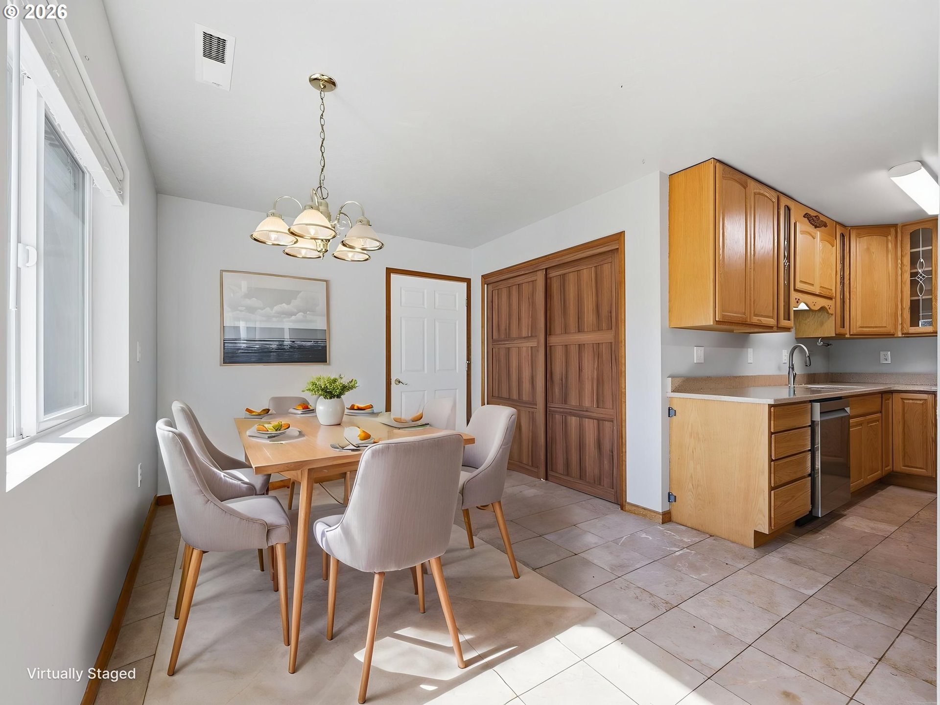 92938 Amie Loop Astoria, OR 97103 - Photo 15 of 42 a view of a dining room with furniture window and wooden floor