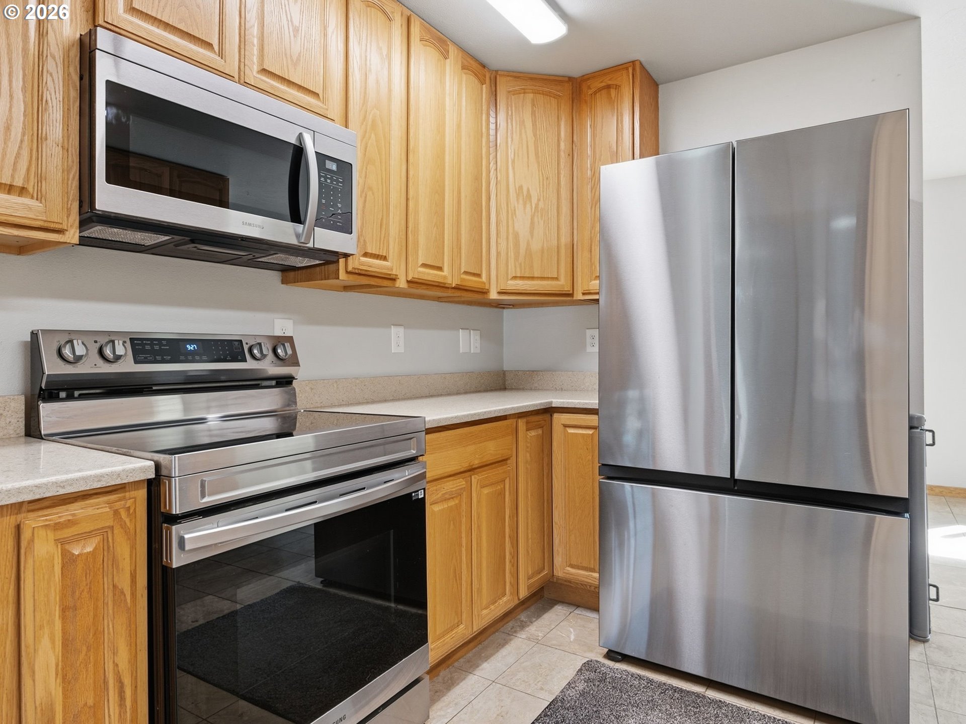 92938 Amie Loop Astoria, OR 97103 - Photo 16 of 42 a kitchen with stainless steel appliances granite countertop a refrigerator microwave and sink