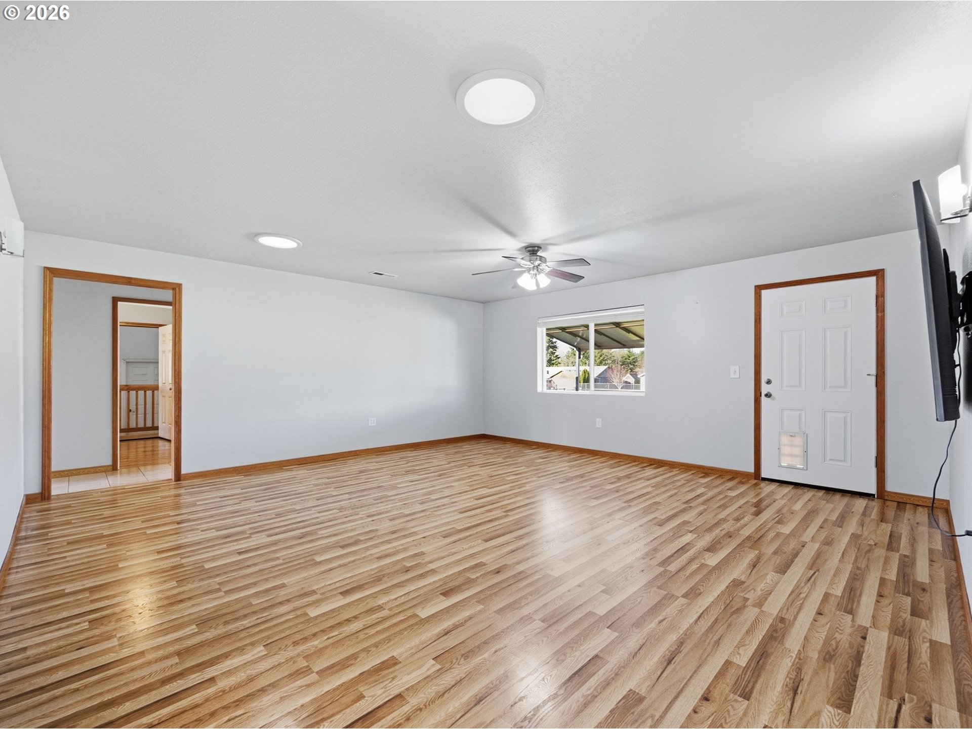 92938 Amie Loop Astoria, OR 97103 - Photo 20 of 42 an empty room with wooden floor closet and windows