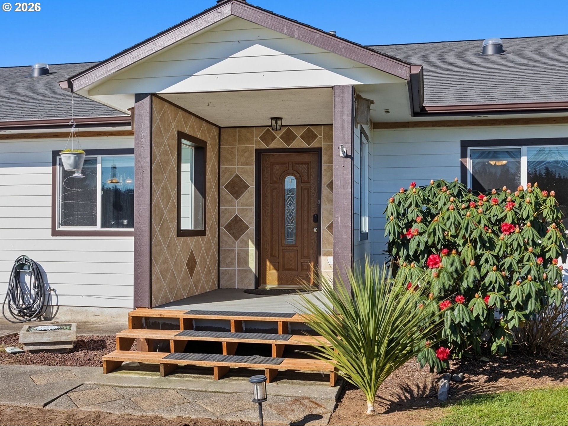 92938 Amie Loop Astoria, OR 97103 - Photo 2 of 42 a house view with a outdoor space