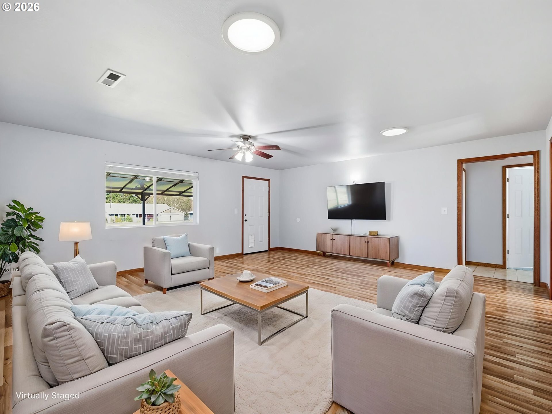 92938 Amie Loop Astoria, OR 97103 - Photo 21 of 42 a living room with furniture and a flat screen tv