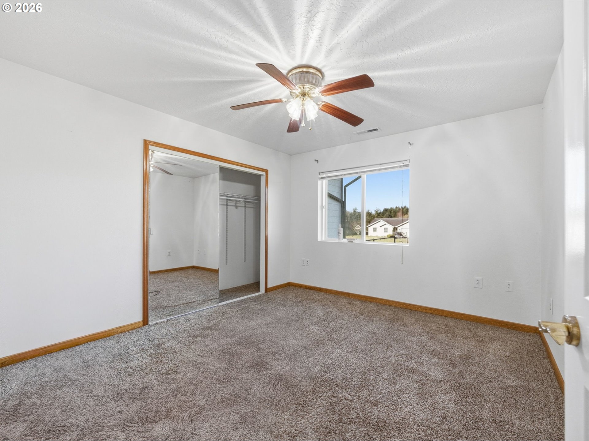 92938 Amie Loop Astoria, OR 97103 - Photo 24 of 42 an empty room with windows and fan