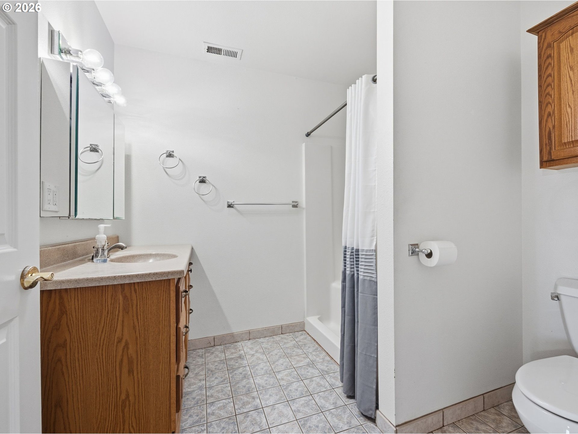 92938 Amie Loop Astoria, OR 97103 - Photo 26 of 42 a bathroom with a sink a toilet and shower