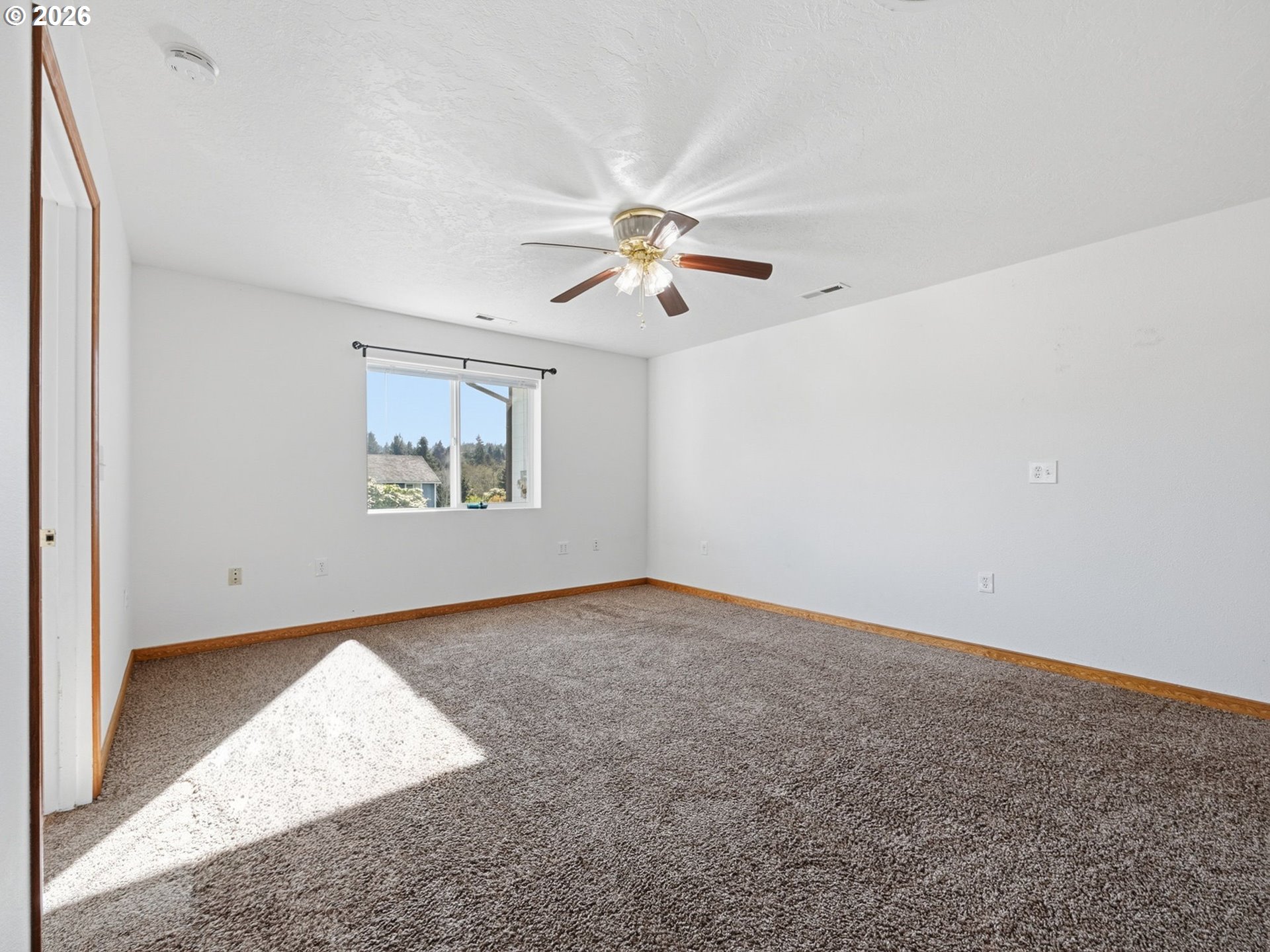 92938 Amie Loop Astoria, OR 97103 - Photo 28 of 42 an empty room with windows and fan