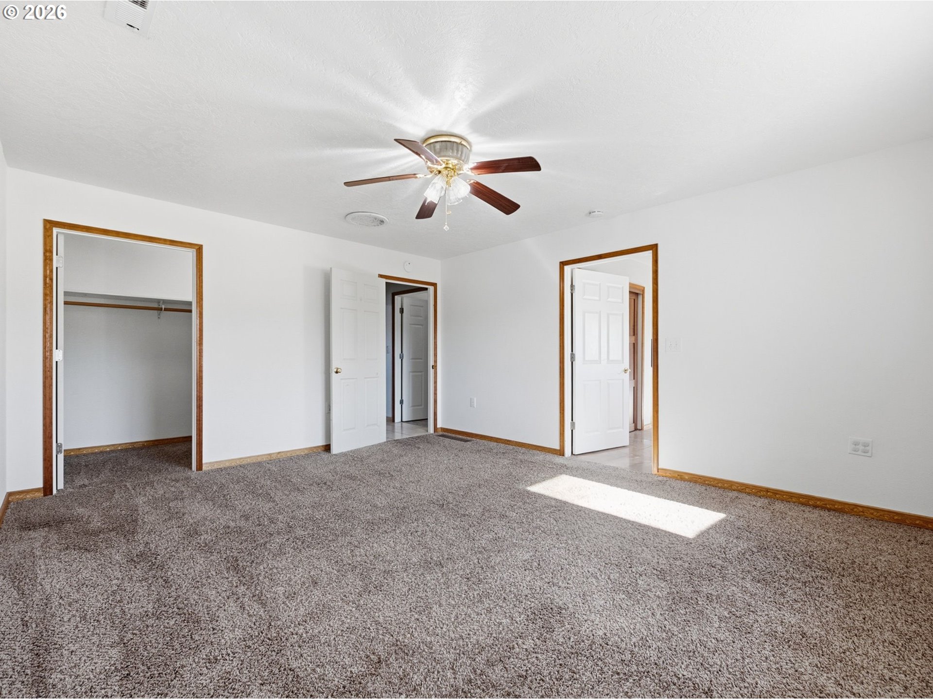 92938 Amie Loop Astoria, OR 97103 - Photo 30 of 42 an empty room with closet and a ceiling fan