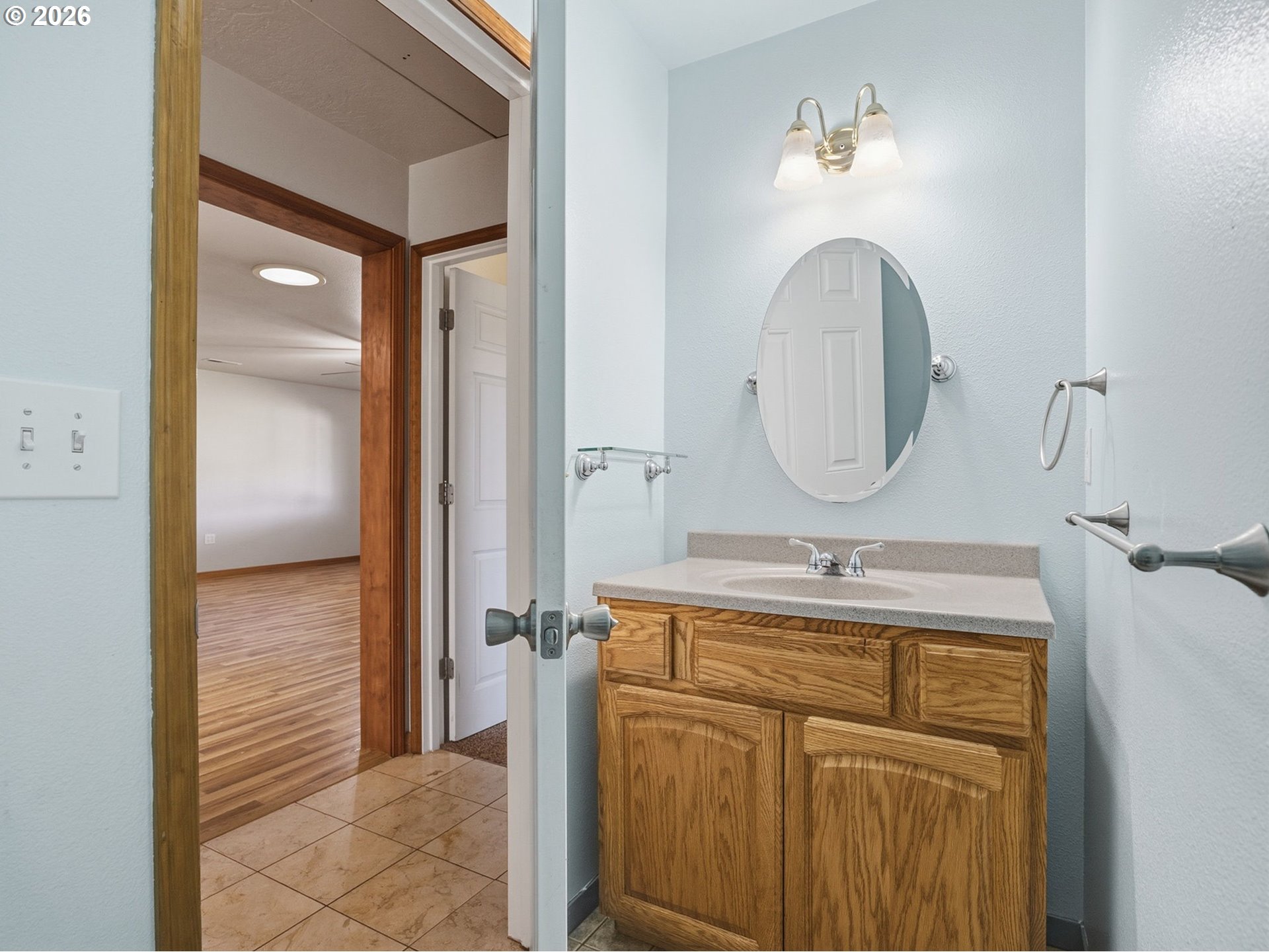 92938 Amie Loop Astoria, OR 97103 - Photo 32 of 42 a bathroom with a sink a vanity and a mirror