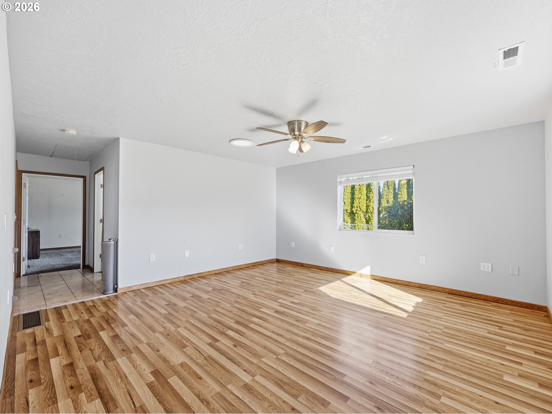 92938 Amie Loop Astoria, OR 97103 - Photo 8 of 42 a view of empty room with wooden floor
