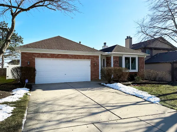a front view of a house with yard