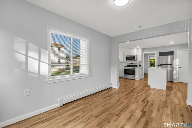 a view of kitchen with wooden floor
