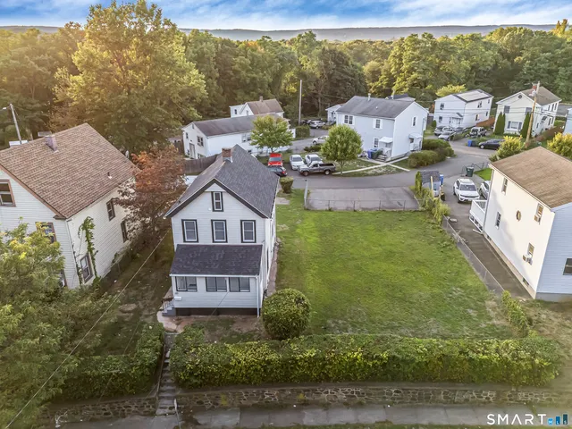 a aerial view of a house with a yard