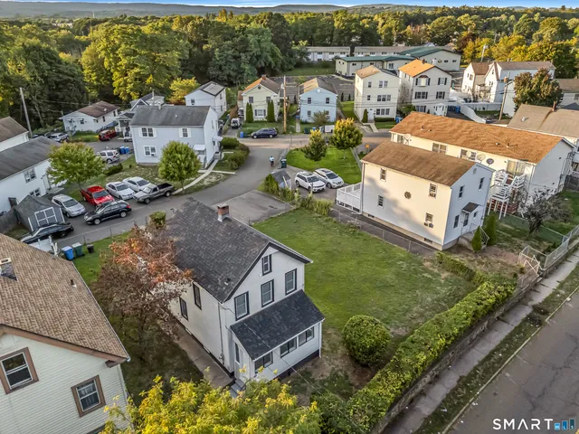 an aerial view of a house with a garden