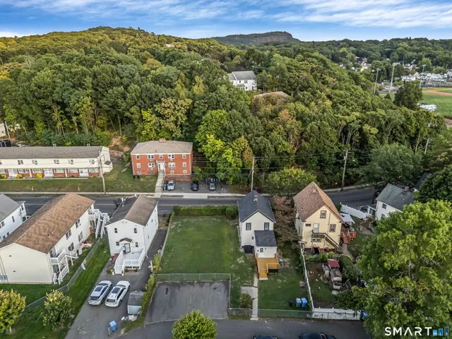 an aerial view of a house with a garden