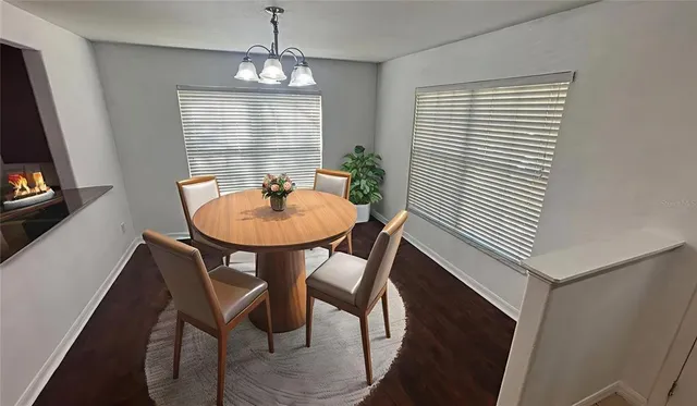 a dining room with furniture and window