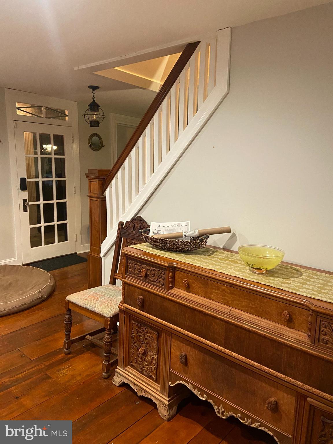 303 Baptist Road Newport, NJ 08345 - Photo 13 of 37 a view of staircase with wooden floor and a rug