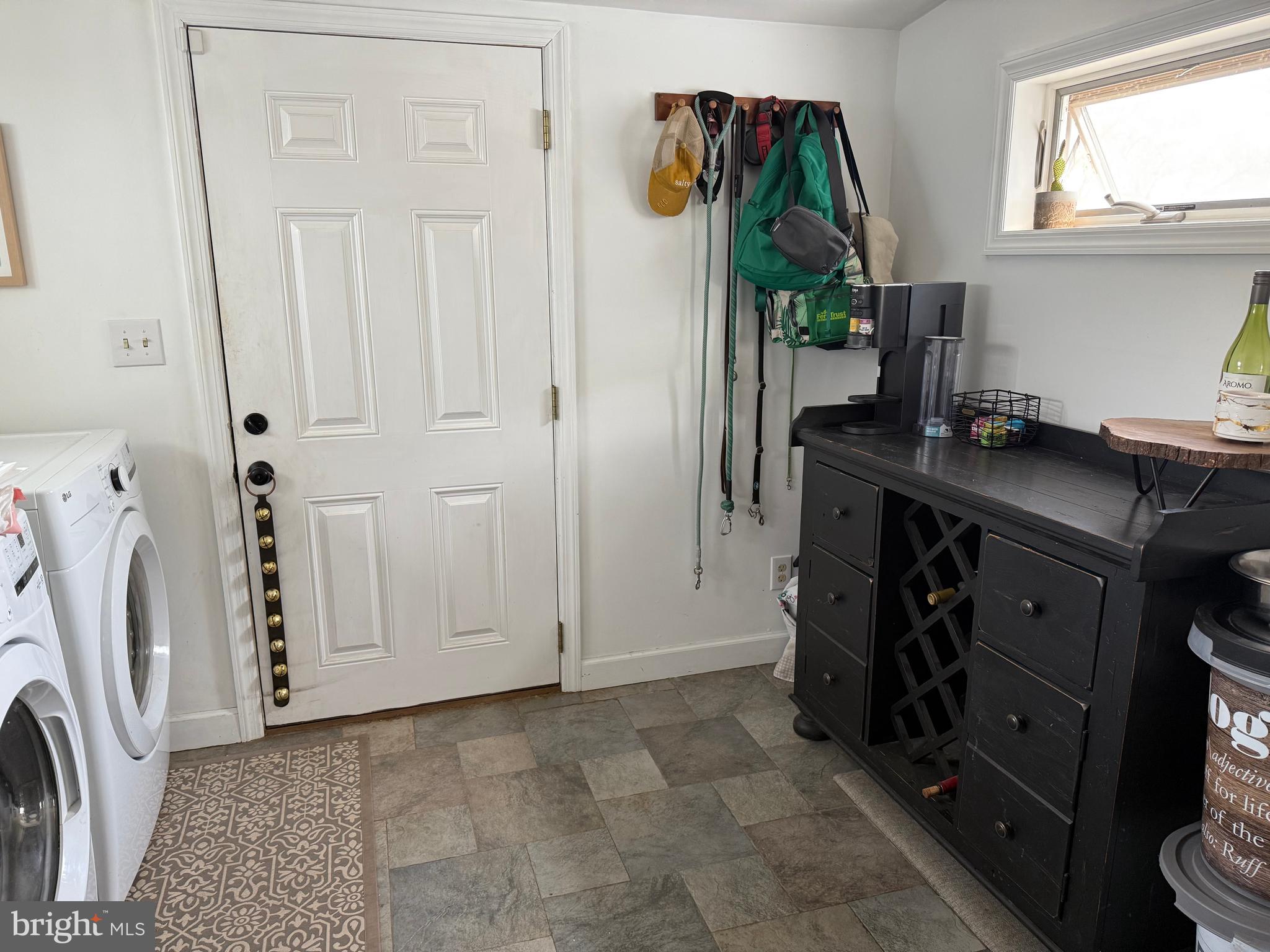 303 Baptist Road Newport, NJ 08345 - Photo 14 of 37 a view of a kitchen with a sink and a washer dryer