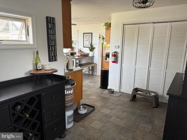 a room with furniture a window and gym equipment