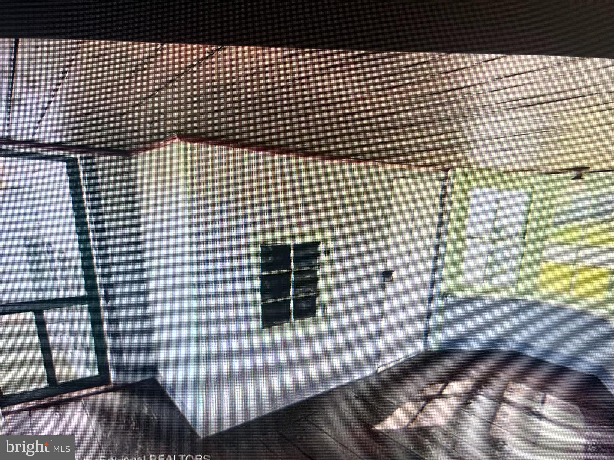303 Baptist Road Newport, NJ 08345 - Photo 19 of 37 a view of an empty room with wooden floor and a window