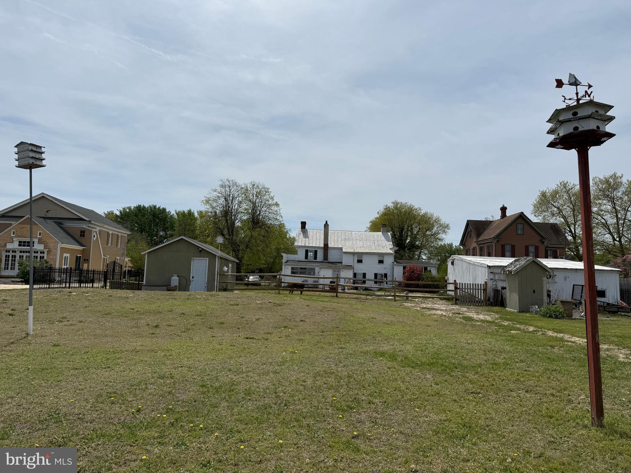 303 Baptist Road Newport, NJ 08345 - Photo 36 of 37 a white house with a big yard and large trees