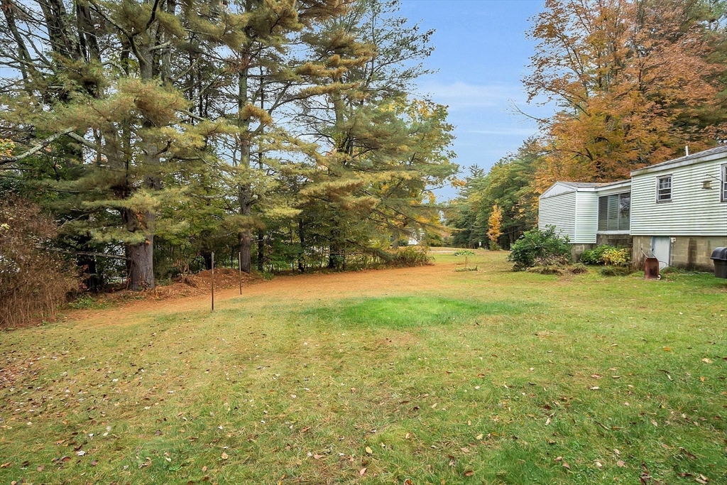 38 South Spencer Road Spencer, MA 01562 - Photo 11 of 14 a swimming pool with outdoor seating and yard