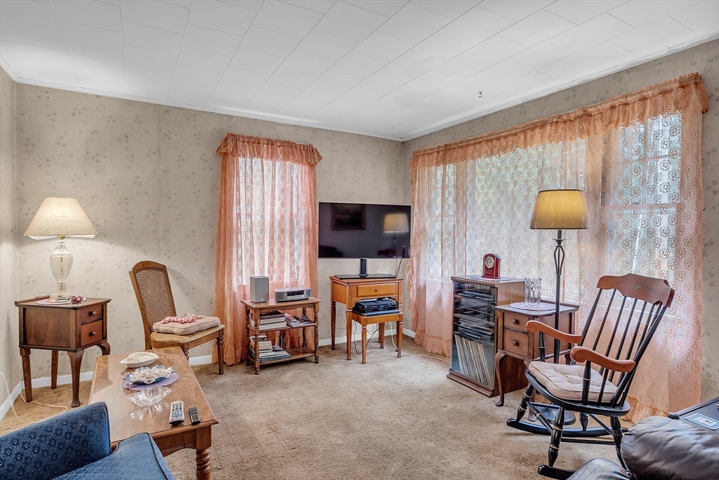38 South Spencer Road Spencer, MA 01562 - Photo 6 of 14 a living room with furniture and a flat screen tv