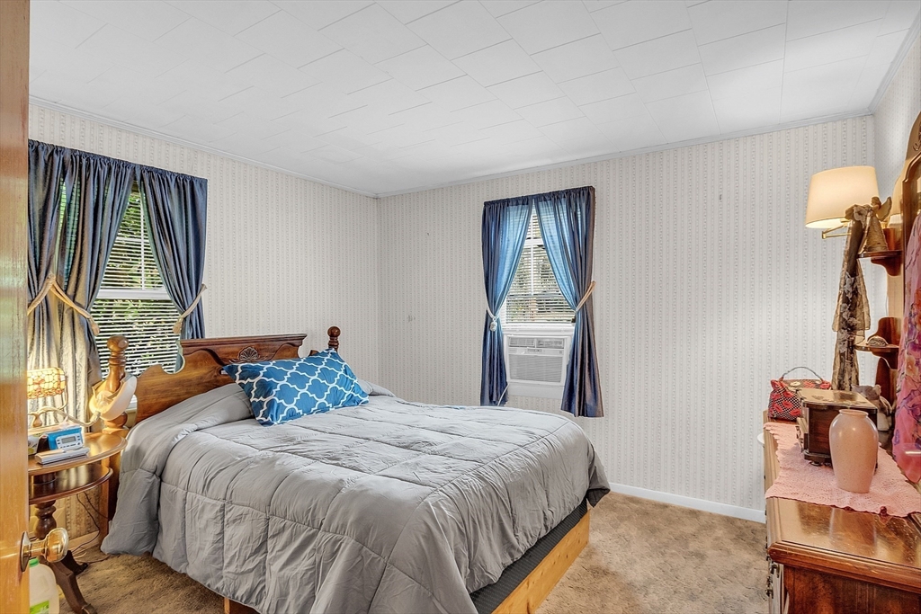 38 South Spencer Road Spencer, MA 01562 - Photo 8 of 14 a bedroom with a bed and wooden floor