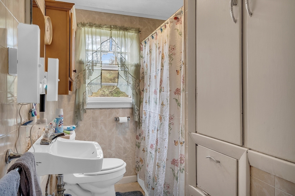 38 South Spencer Road Spencer, MA 01562 - Photo 10 of 14 a bathroom with a sink toilet and shower