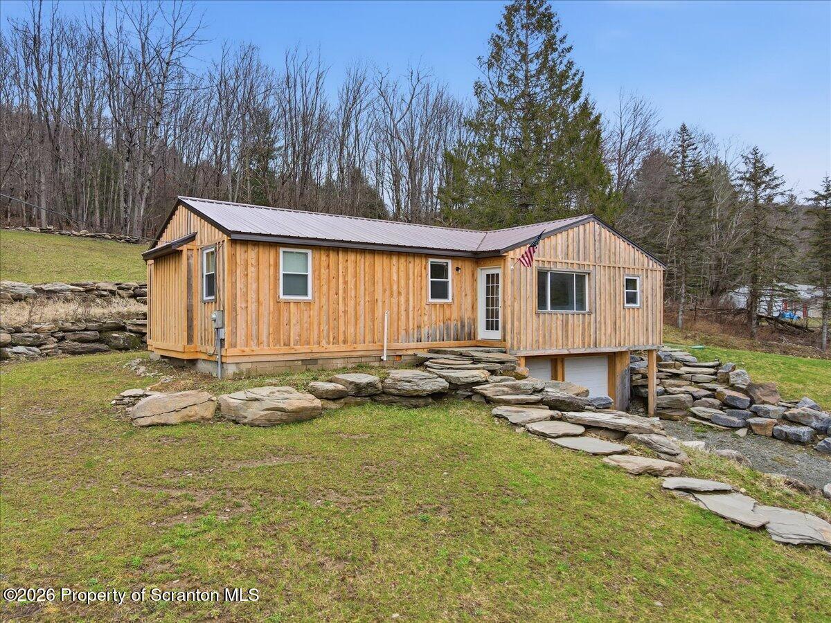 232 Starrucca Creek Road Starrucca, PA 18462 - Photo 2 of 64 a view of a house with pool and sitting area