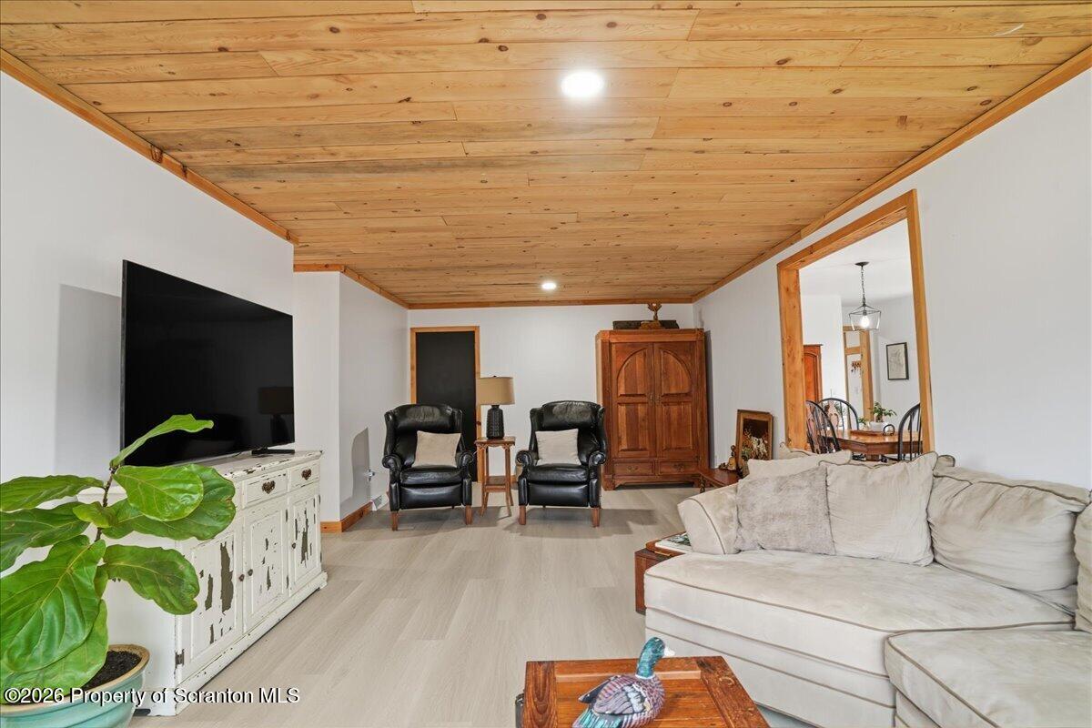 232 Starrucca Creek Road Starrucca, PA 18462 - Photo 28 of 64 a living room with furniture and a flat screen tv