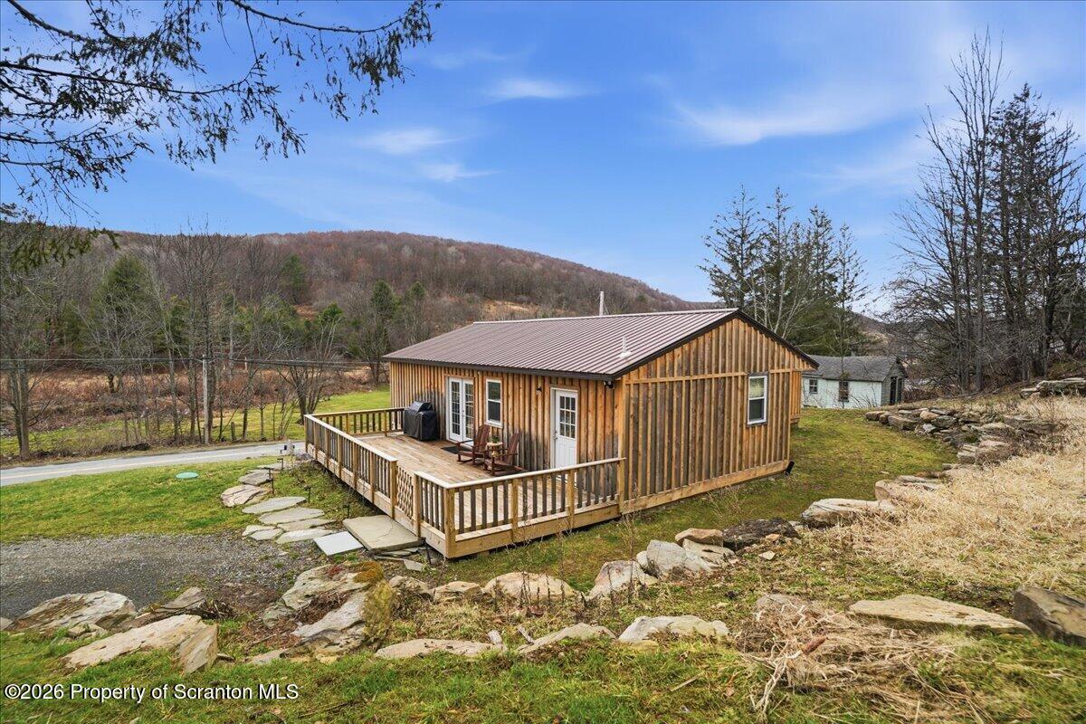 232 Starrucca Creek Road Starrucca, PA 18462 - Photo 47 of 64 a view of a house with a wooden fence
