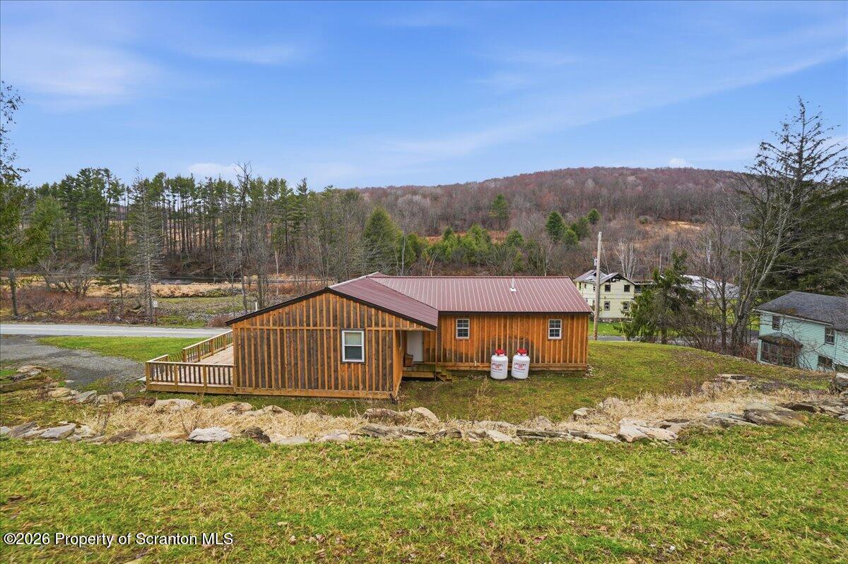 232 Starrucca Creek Road Starrucca, PA 18462 - Photo 48 of 64 a aerial view of a house with a yard