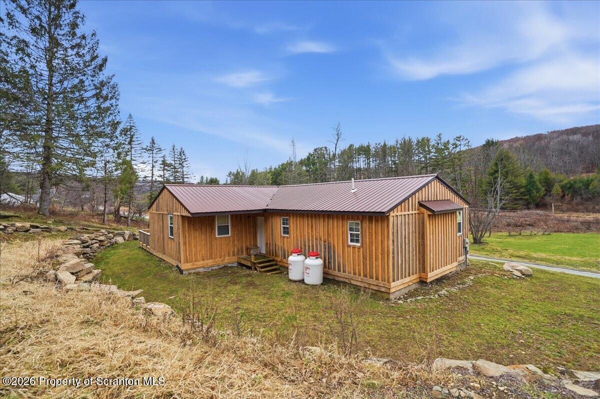 232 Starrucca Creek Road Starrucca, PA 18462 - Photo 50 of 64 a view of a house with a yard