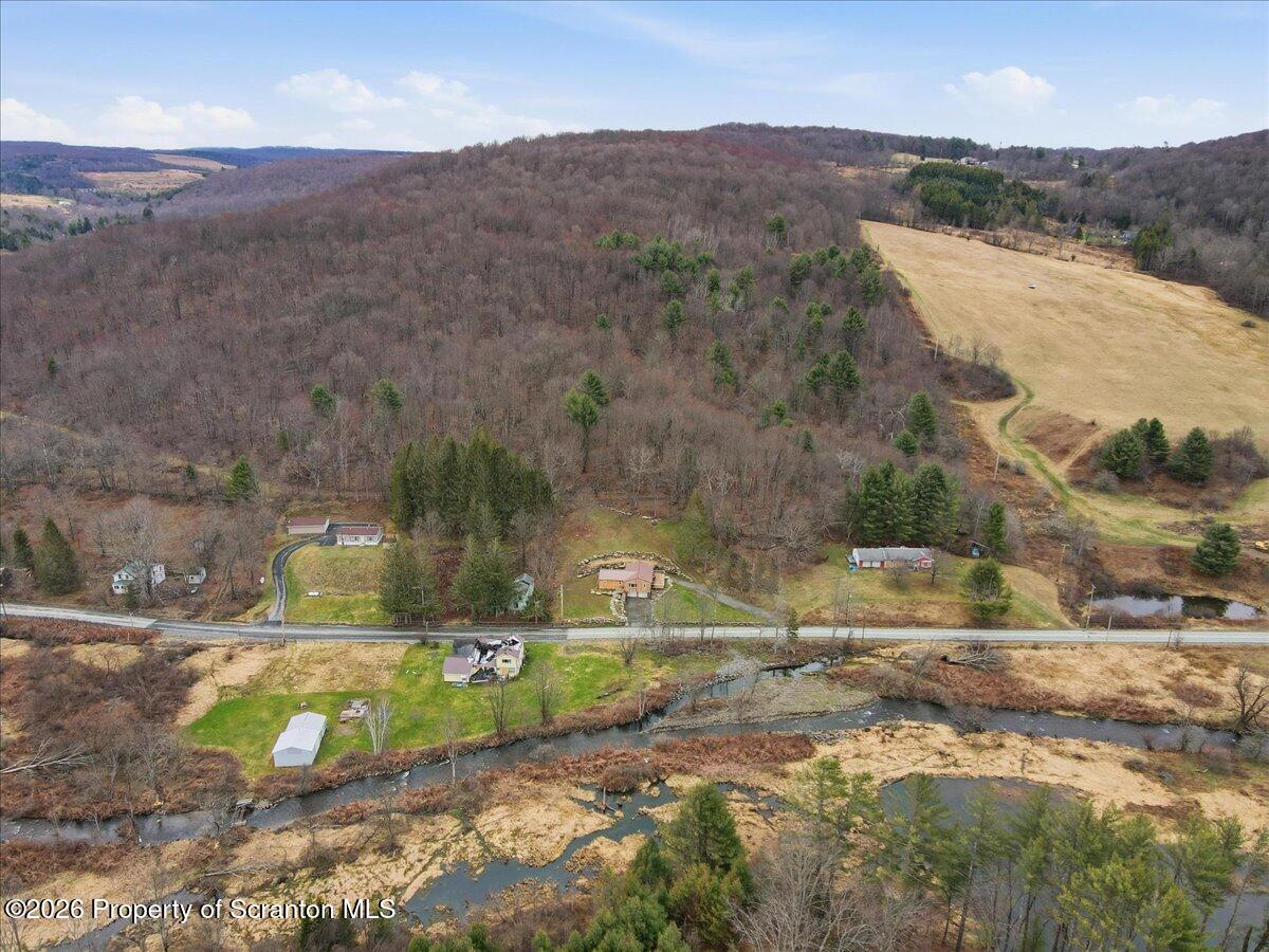 232 Starrucca Creek Road Starrucca, PA 18462 - Photo 54 of 64 a view of a lake in middle of the town