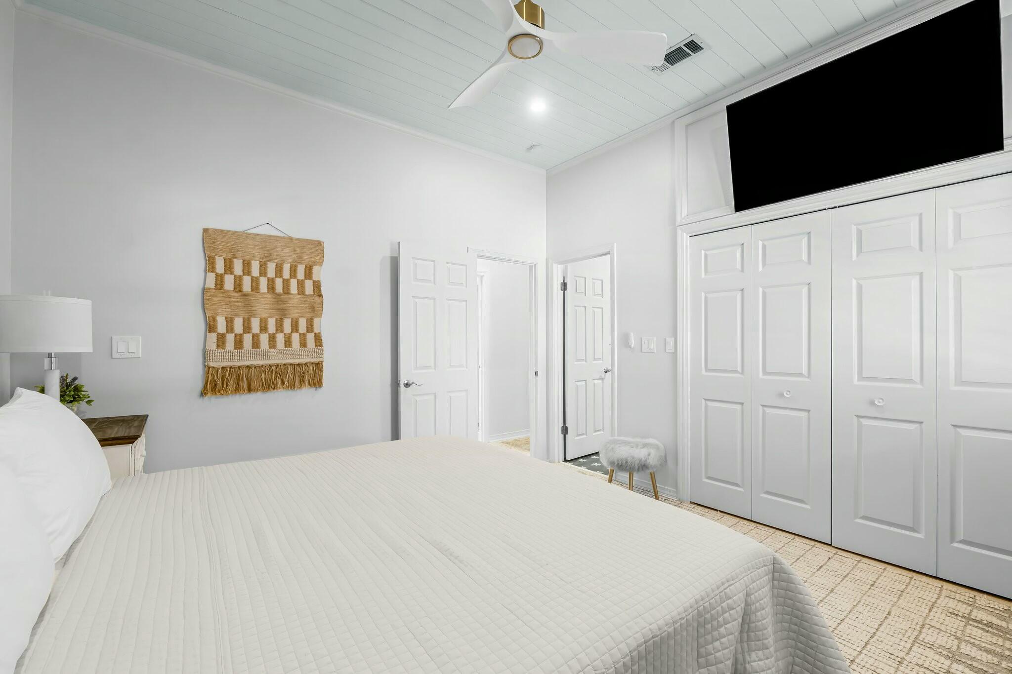 15 Maple Street Santa Rosa Beach, FL 32459 - Photo 13 of 34 a bedroom with a bed and a flat screen tv