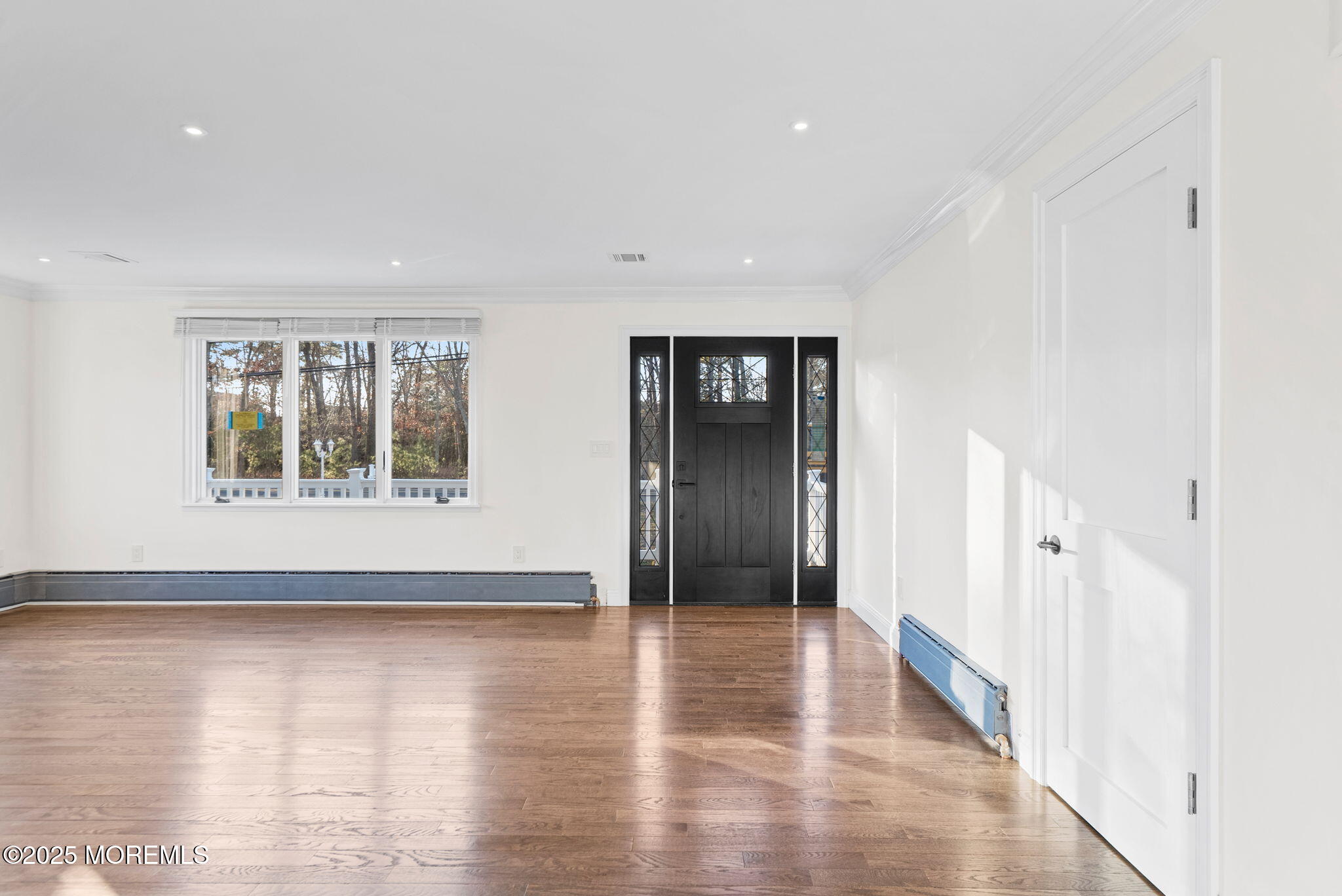 458 Newtons Corner Road Howell, NJ 07731 - Photo 13 of 44 a view of an empty room with wooden floor and a window