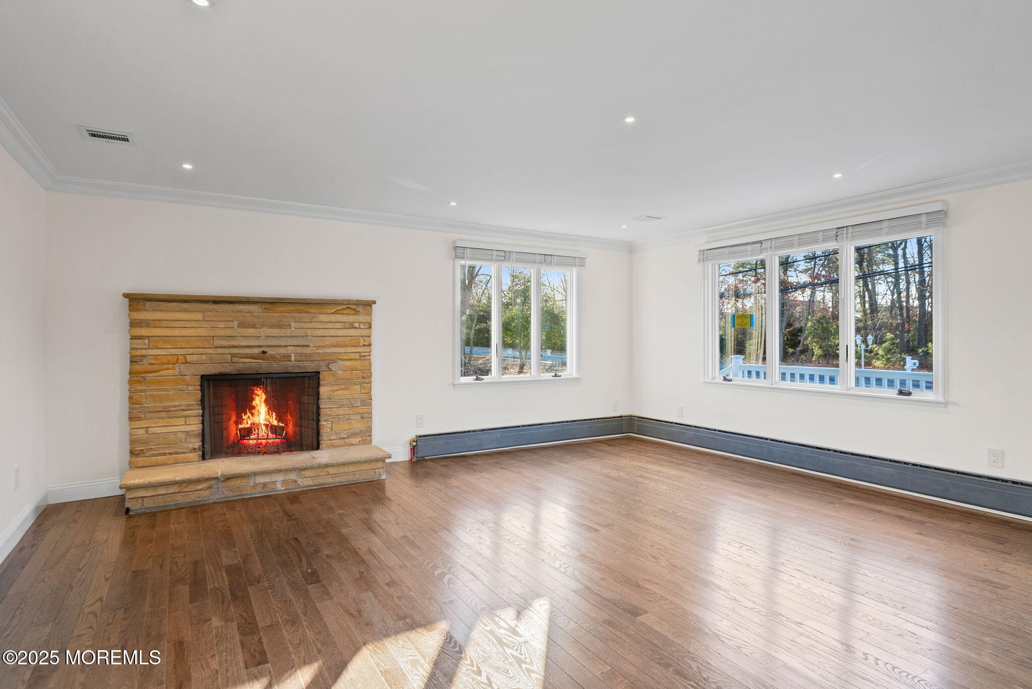 458 Newtons Corner Road Howell, NJ 07731 - Photo 16 of 44 a view of an empty room with window and fire place