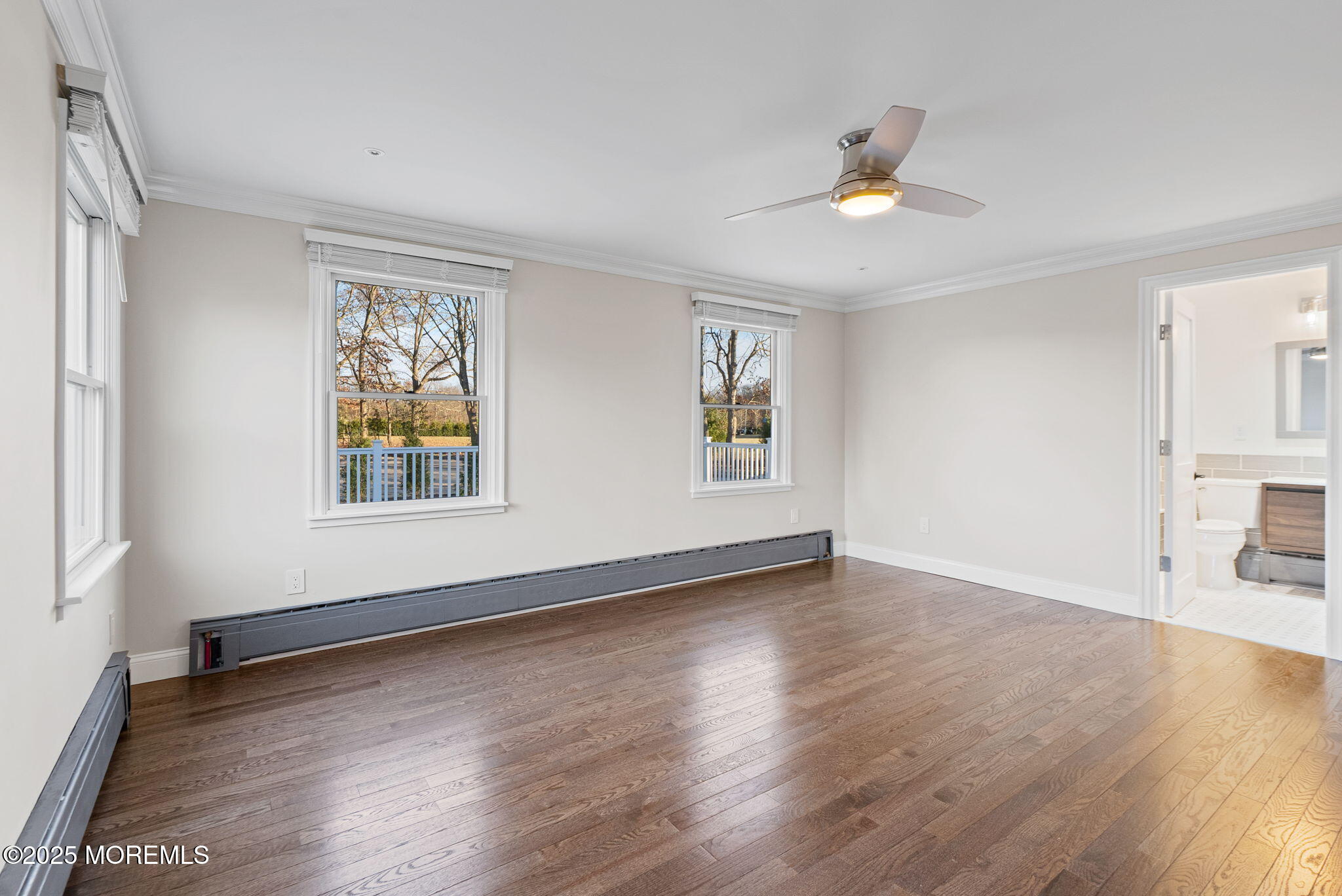 458 Newtons Corner Road Howell, NJ 07731 - Photo 22 of 44 a view of an empty room with wooden floor and a window