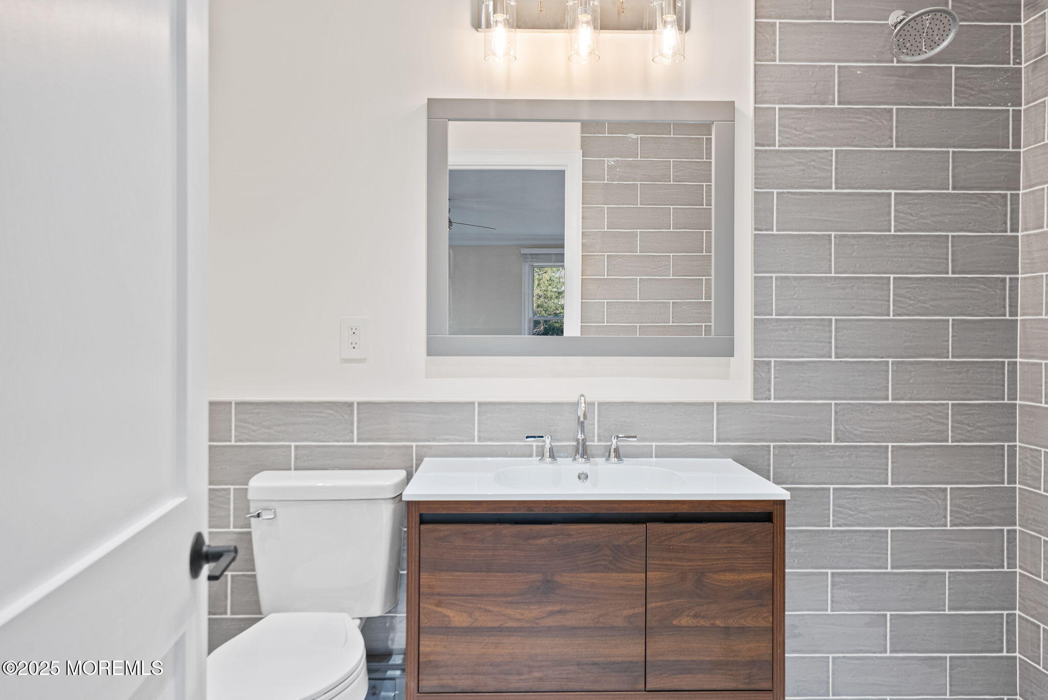 458 Newtons Corner Road Howell, NJ 07731 - Photo 23 of 44 a bathroom with a sink vanity and toilet