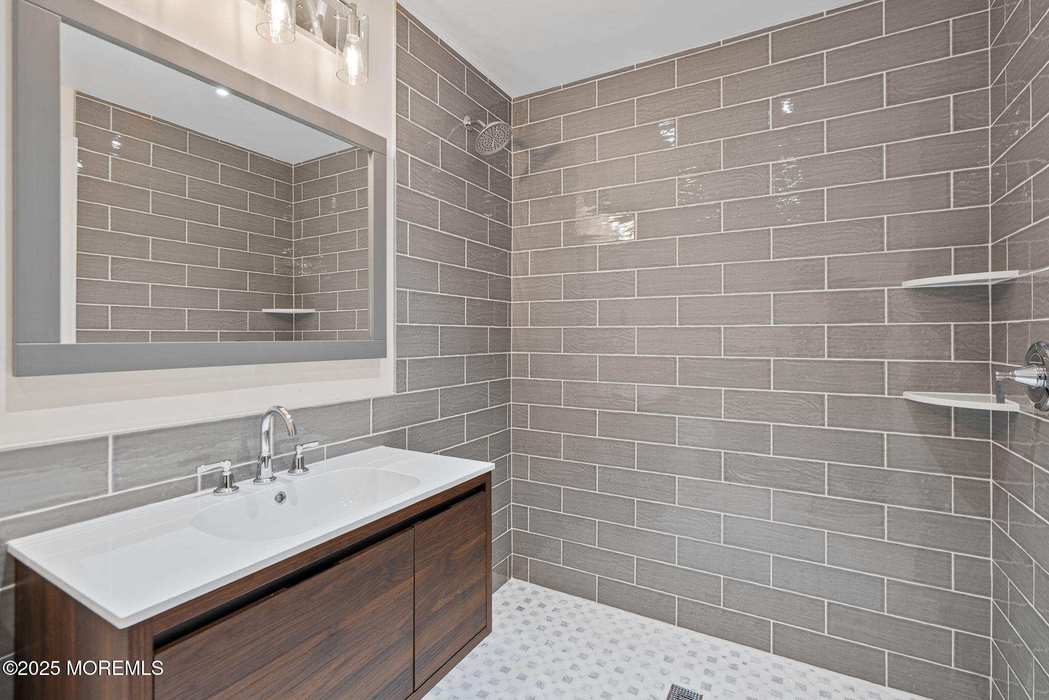 458 Newtons Corner Road Howell, NJ 07731 - Photo 24 of 44 a bathroom with a sink a mirror and a shower