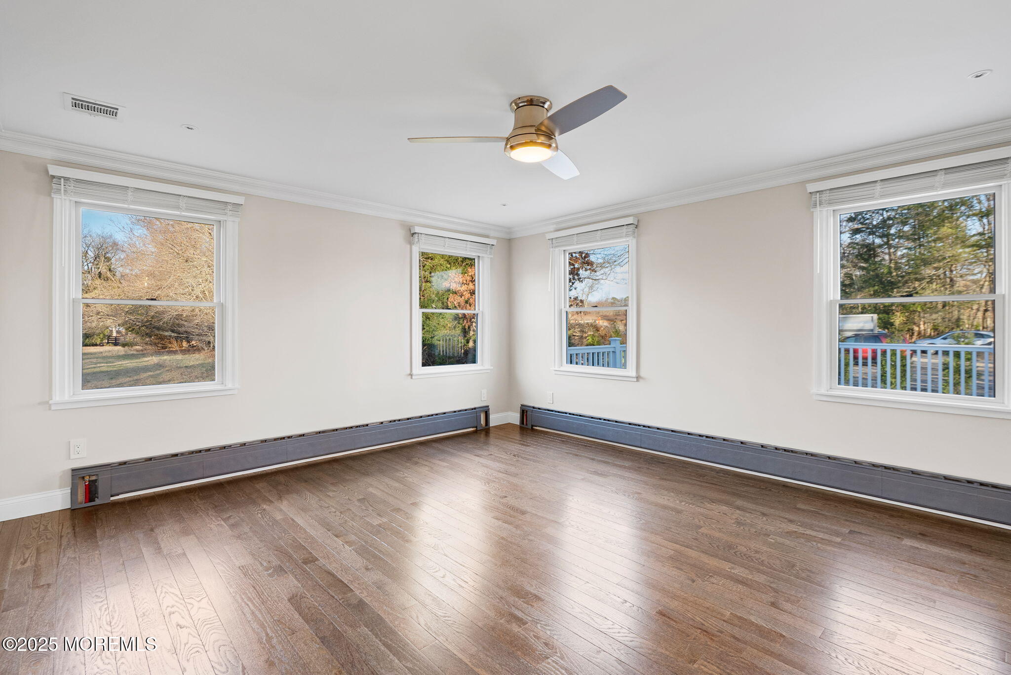 458 Newtons Corner Road Howell, NJ 07731 - Photo 28 of 44 a view of an empty room with wooden floor and a window