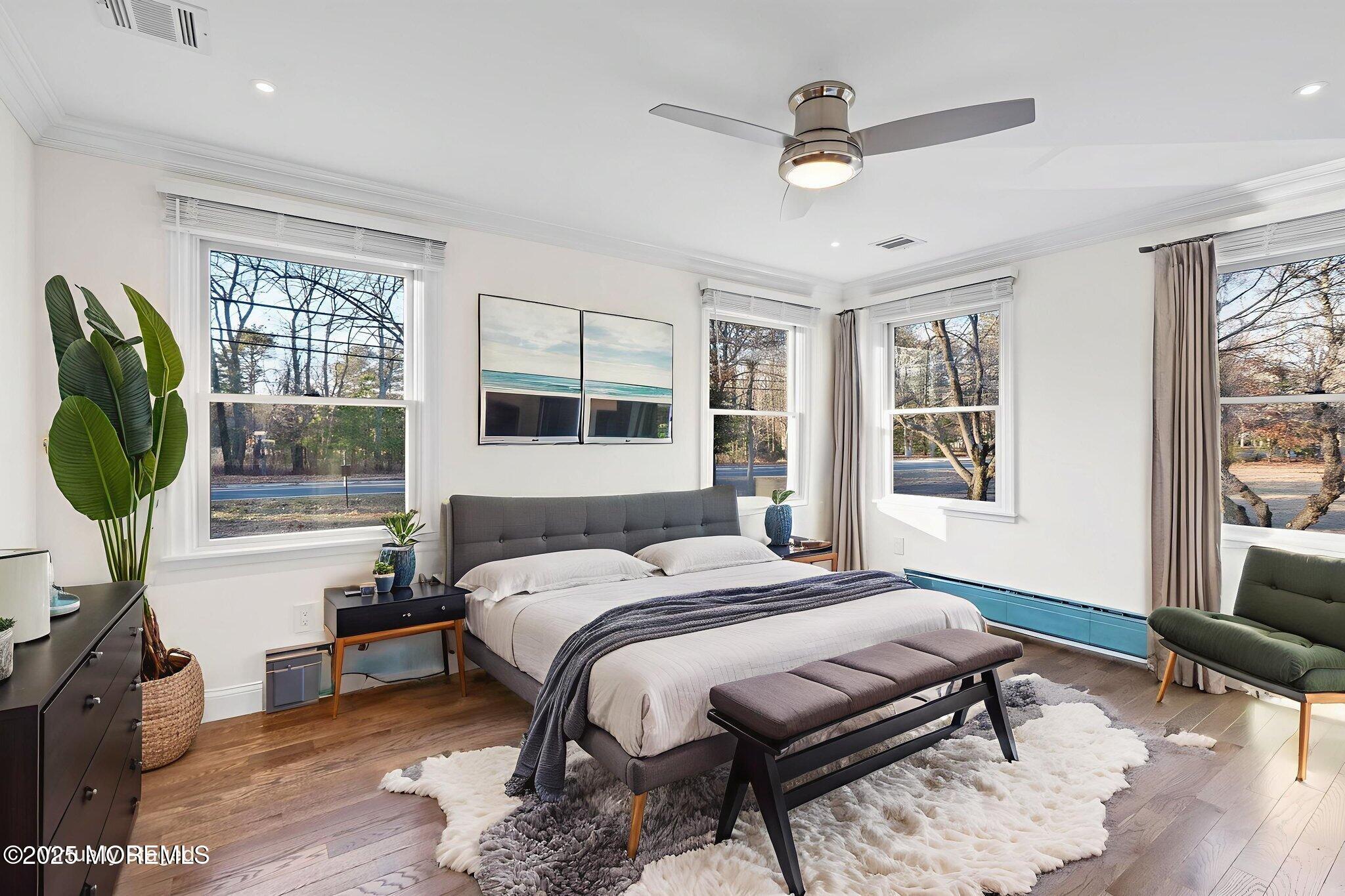 458 Newtons Corner Road Howell, NJ 07731 - Photo 30 of 44 a bedroom with a bed a window and potted plant on the table