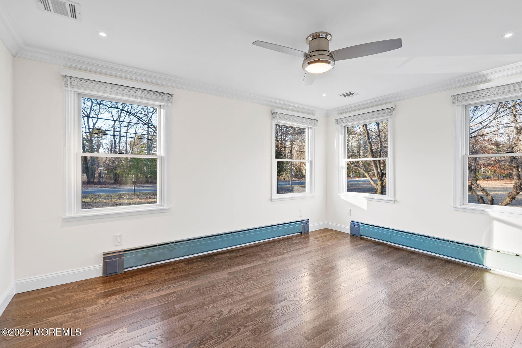 458 Newtons Corner Road Howell, NJ 07731 - Photo 31 of 44 a view of an empty room with wooden floor and a window