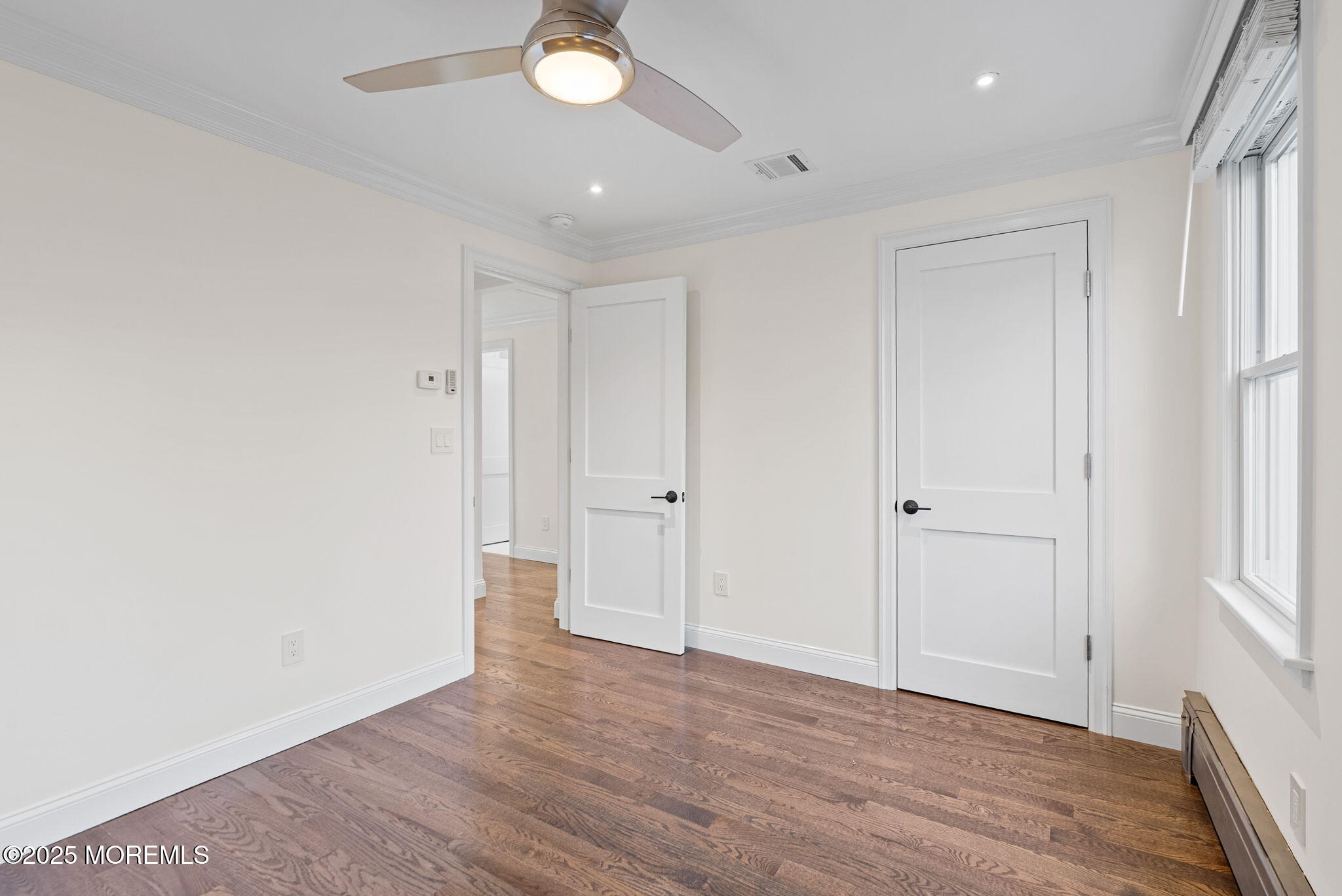 458 Newtons Corner Road Howell, NJ 07731 - Photo 34 of 44 a view of an empty room with wooden floor