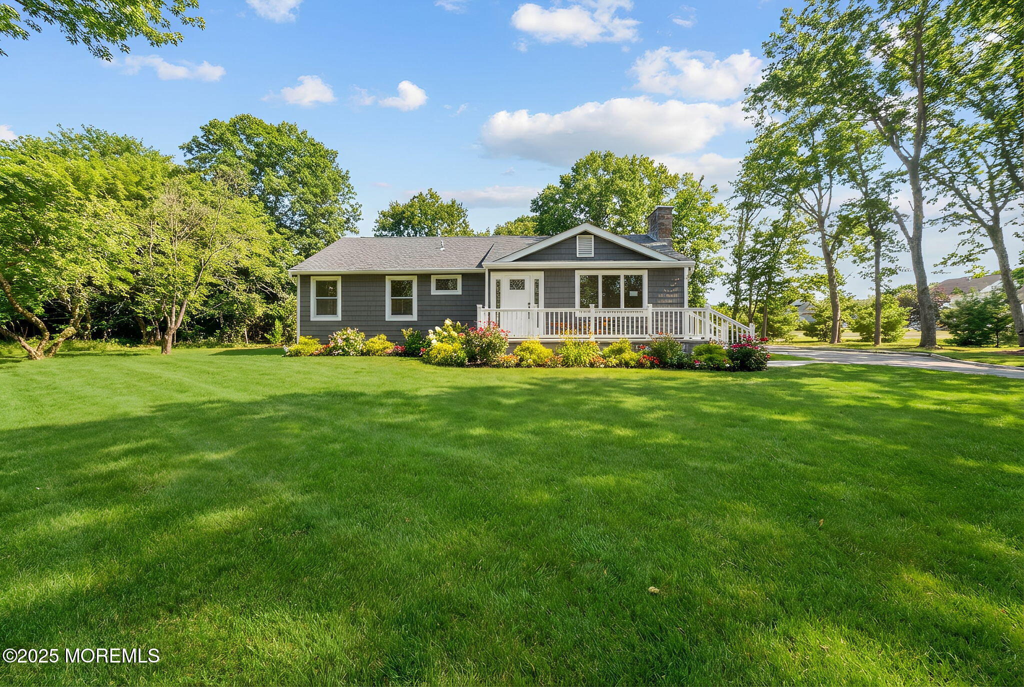 458 Newtons Corner Road Howell, NJ 07731 - Photo 41 of 44 a front view of a house with a garden